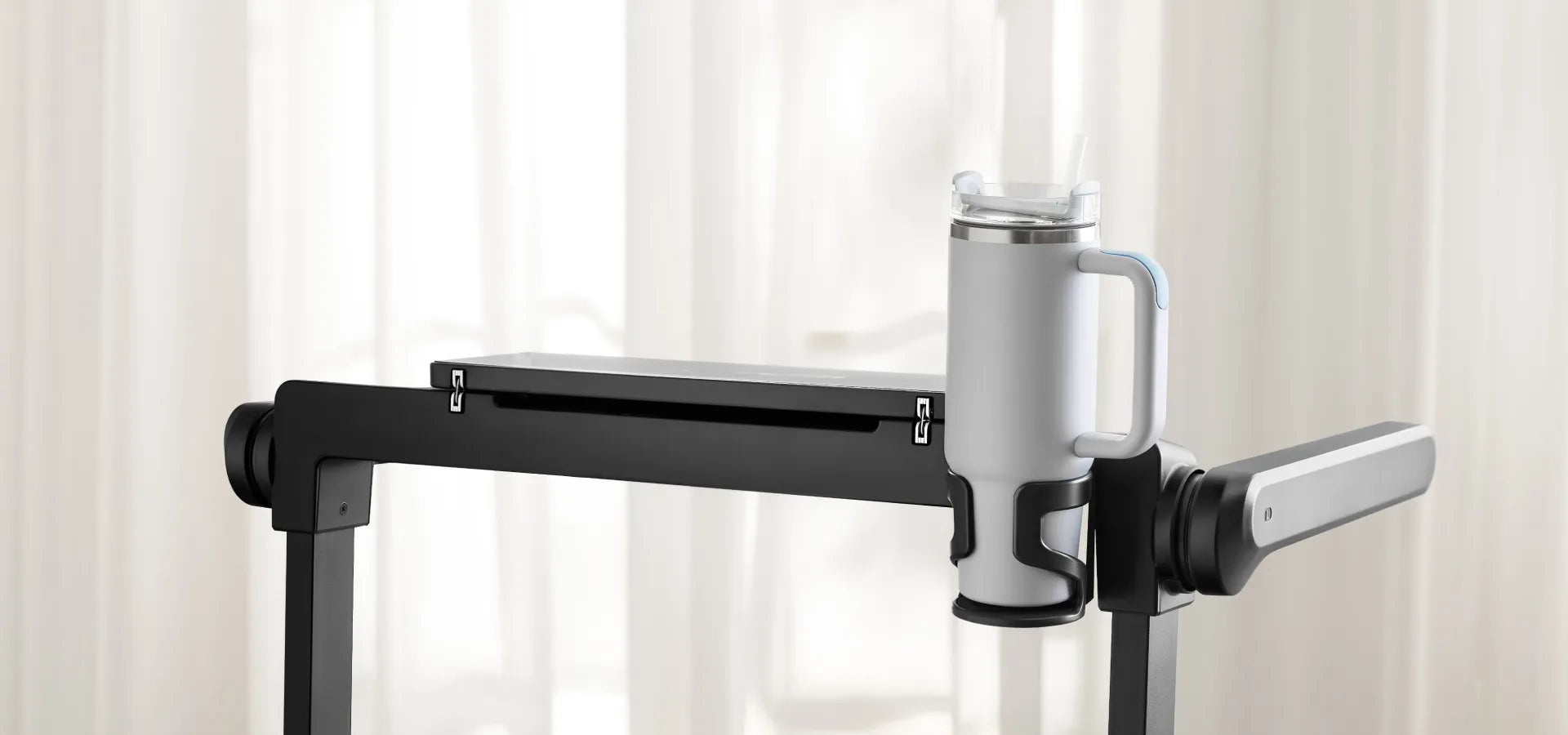 Drink holder on the WalkingPad MX10 treadmill designed to hold mugs and tumblers during workouts
