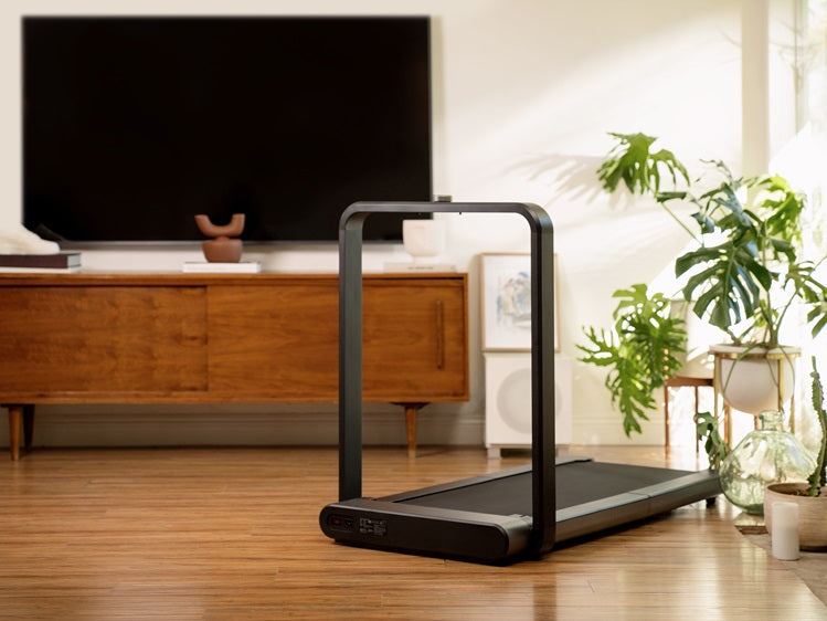 WalkingPad X21 folding treadmill in a modern living room with a space-saving design