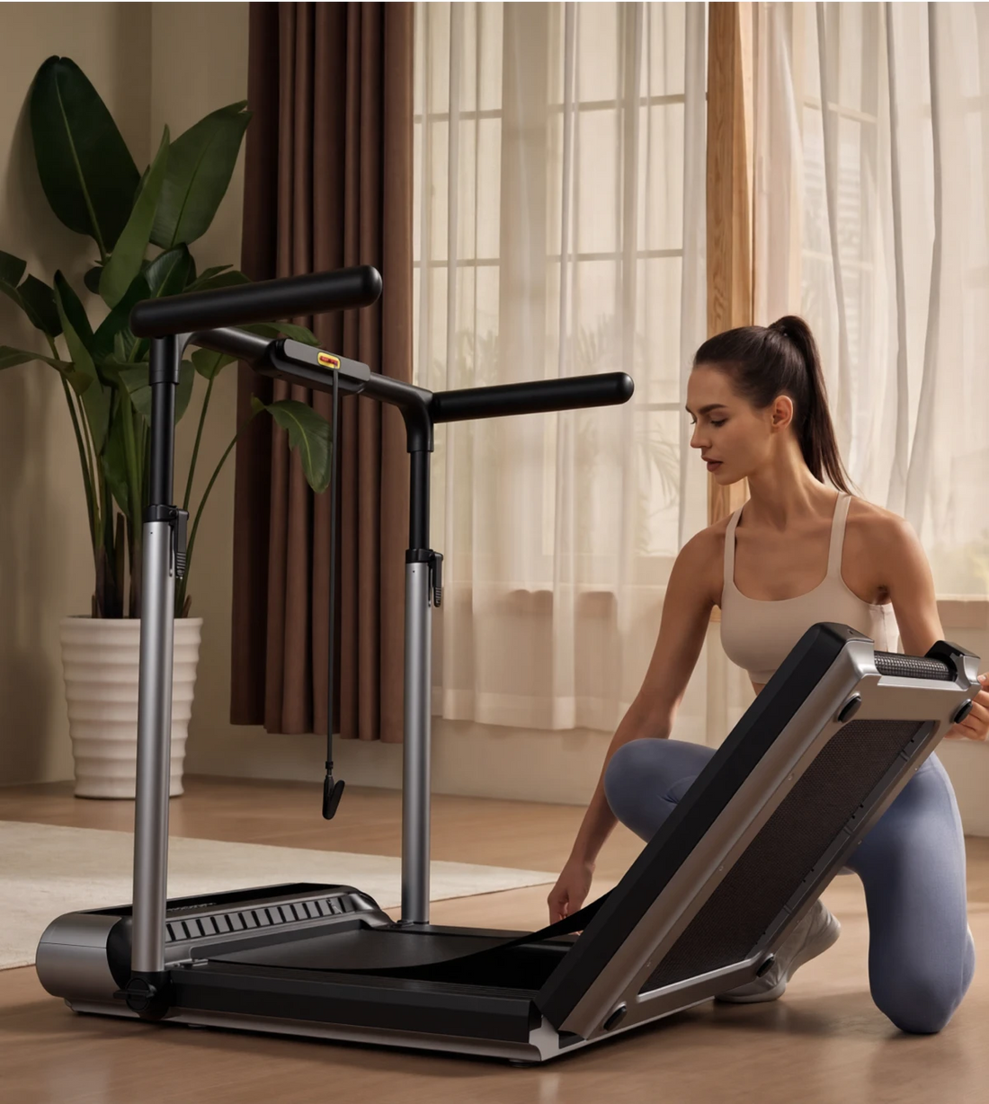 Woman unfolding MX3 treadmill deck and handrail, showing simple and smooth setup process.