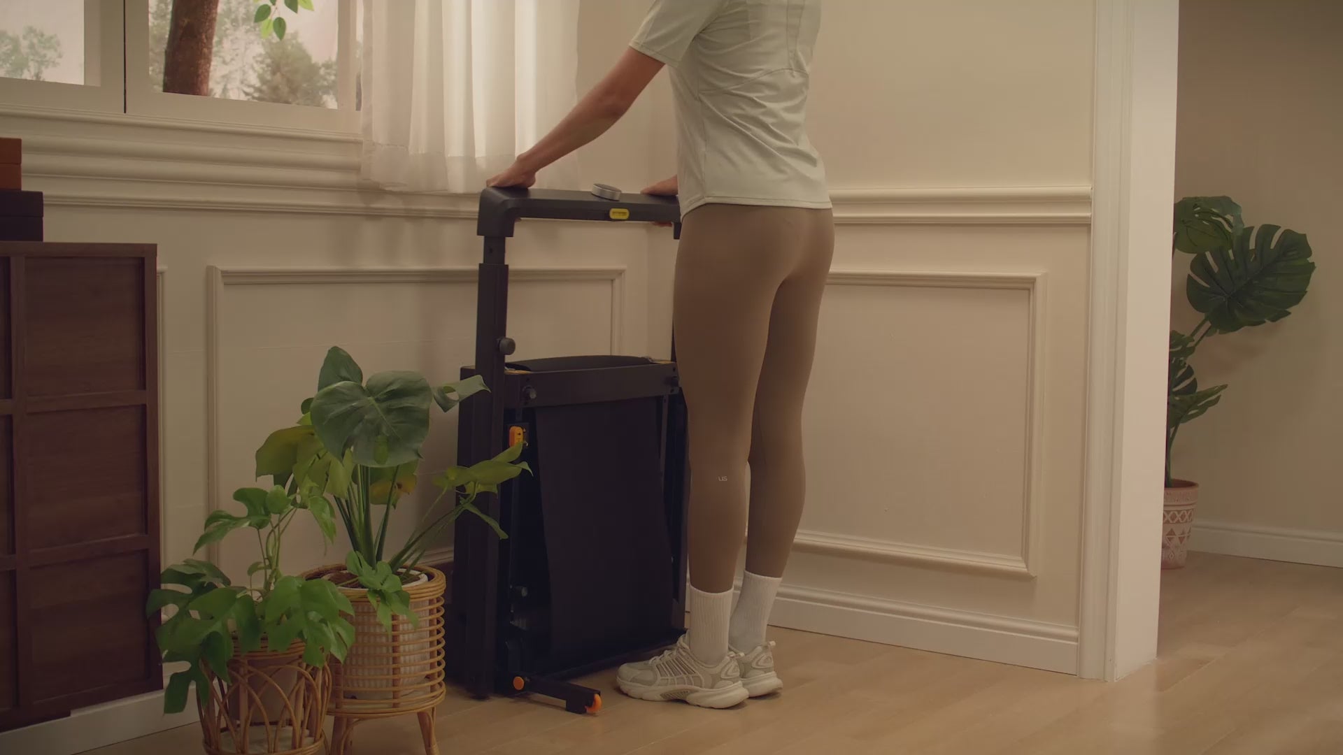 Load video: [video]WalkingPad MX8 Plus treadmill home workout demonstration in a modern living room