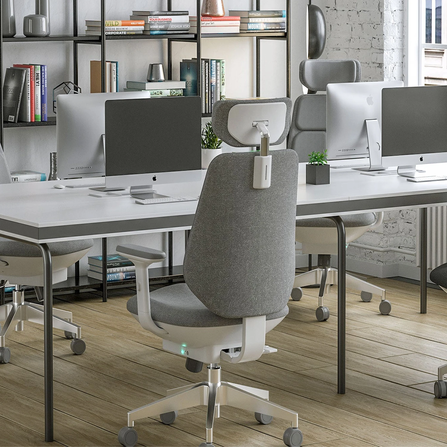 [scene] Air-Smart chair in modern open office workspace with multiple workstations.