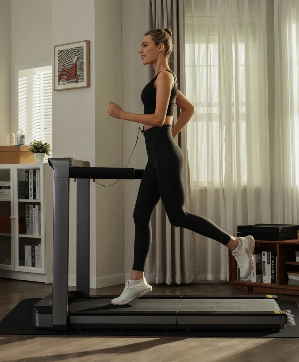 woman running on treadmill with mat shock absorption home workout