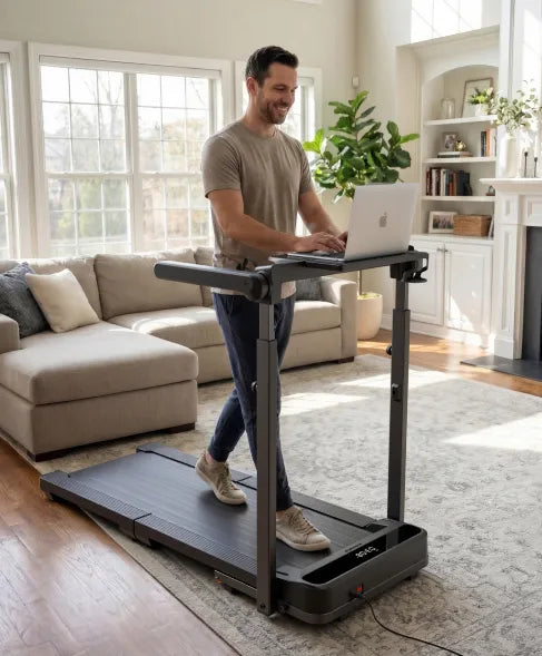 Man walking on the WalkingPad MX10 treadmill while working at a standing desk