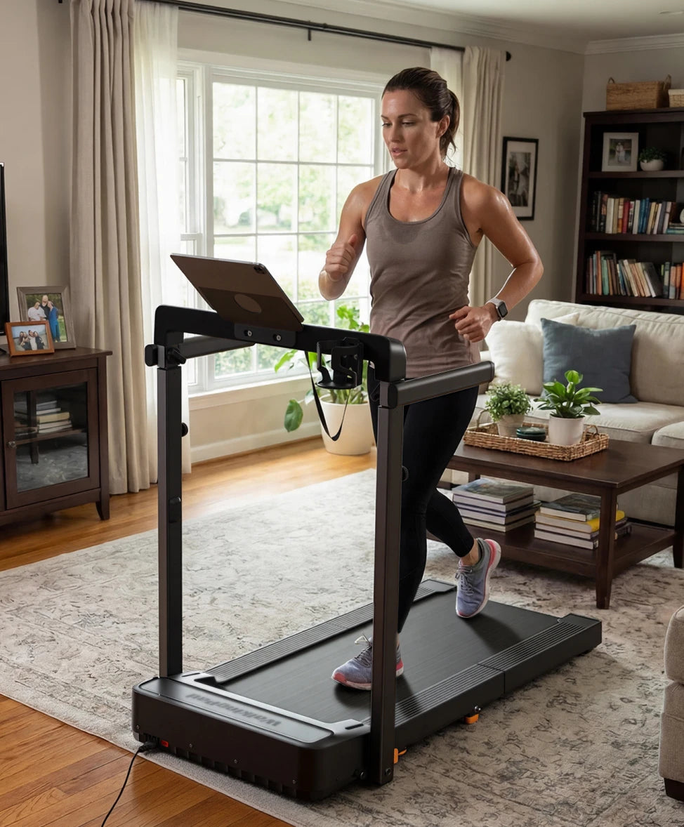 Woman walking on WalkingPad MX8 treadmill during a home workout in a bright living room