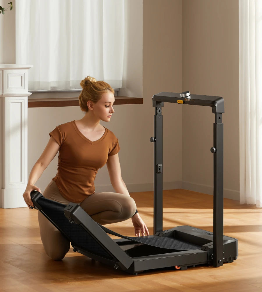 WalkingPad MX8 treadmill stored vertically against a wall to maximize space in small homes