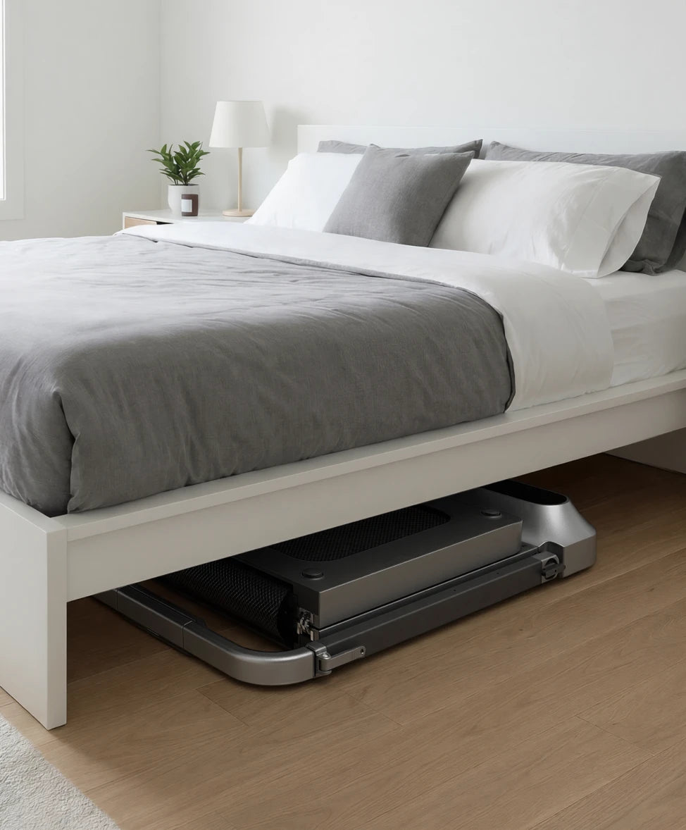 WalkingPad R2 treadmill folded and stored under a bed to save space