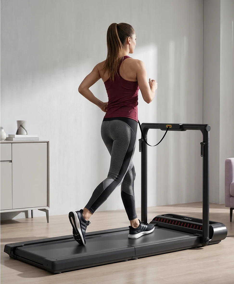 Woman running on WalkingPad R3 Hybrid treadmill for daily home fitness training