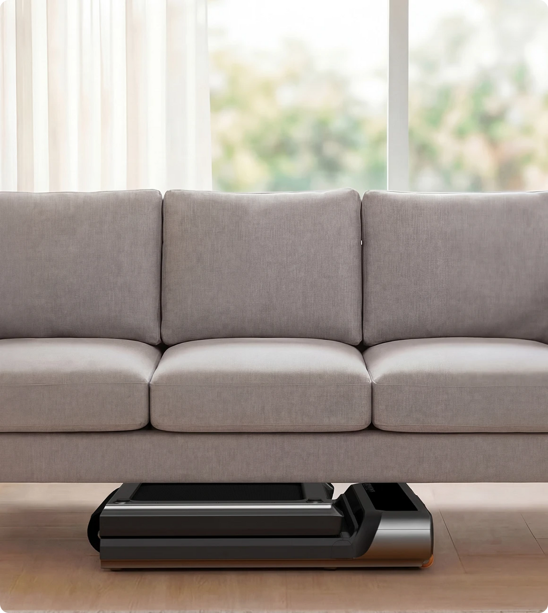 WalkingPad R3 treadmill folded and stored under sofa for space saving