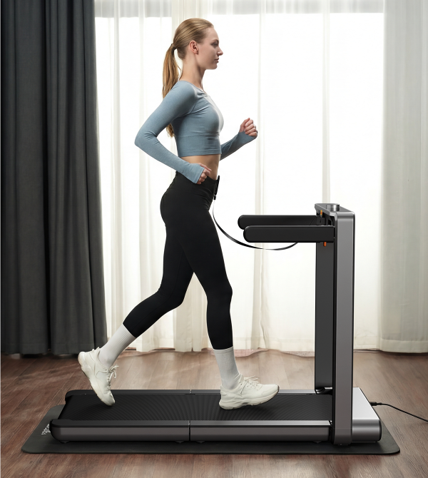 Woman running on the WalkingPad X214 treadmill during an indoor workout