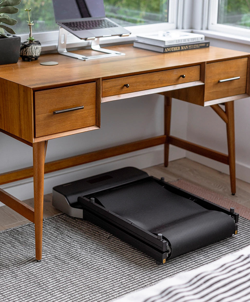 WalkingPad Z1 walking pad stored under desk for space-efficient storage