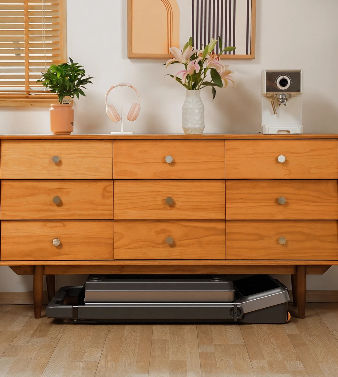 WalkingPad Z3 Hybrid treadmill folded and stored under a sofa to save space